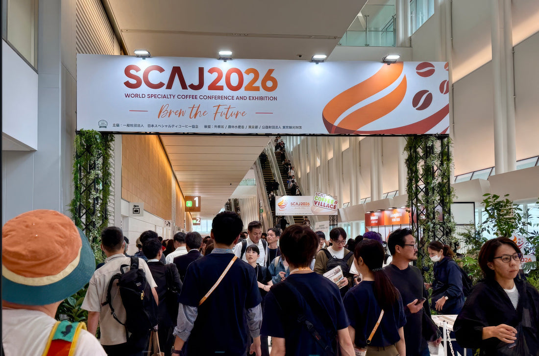 Visitors beneath the SCAJ 2026 entrance banner in Japan